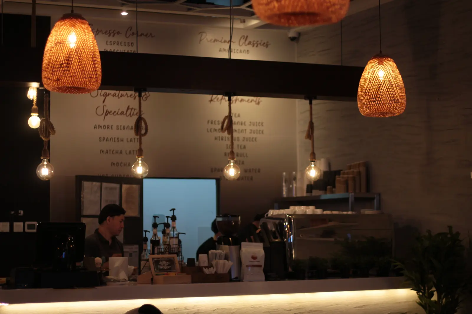 Baristas preparing coffee at the Espresso Amore bar