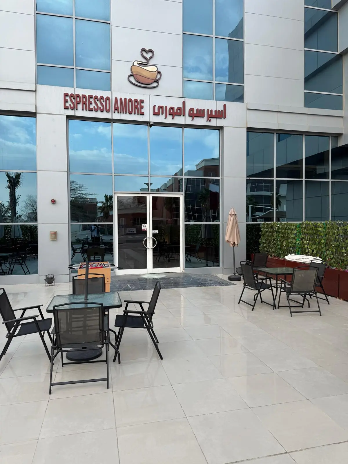 Espresso Amore café entrance at Al Thumama Mall with its sign and terrace seating